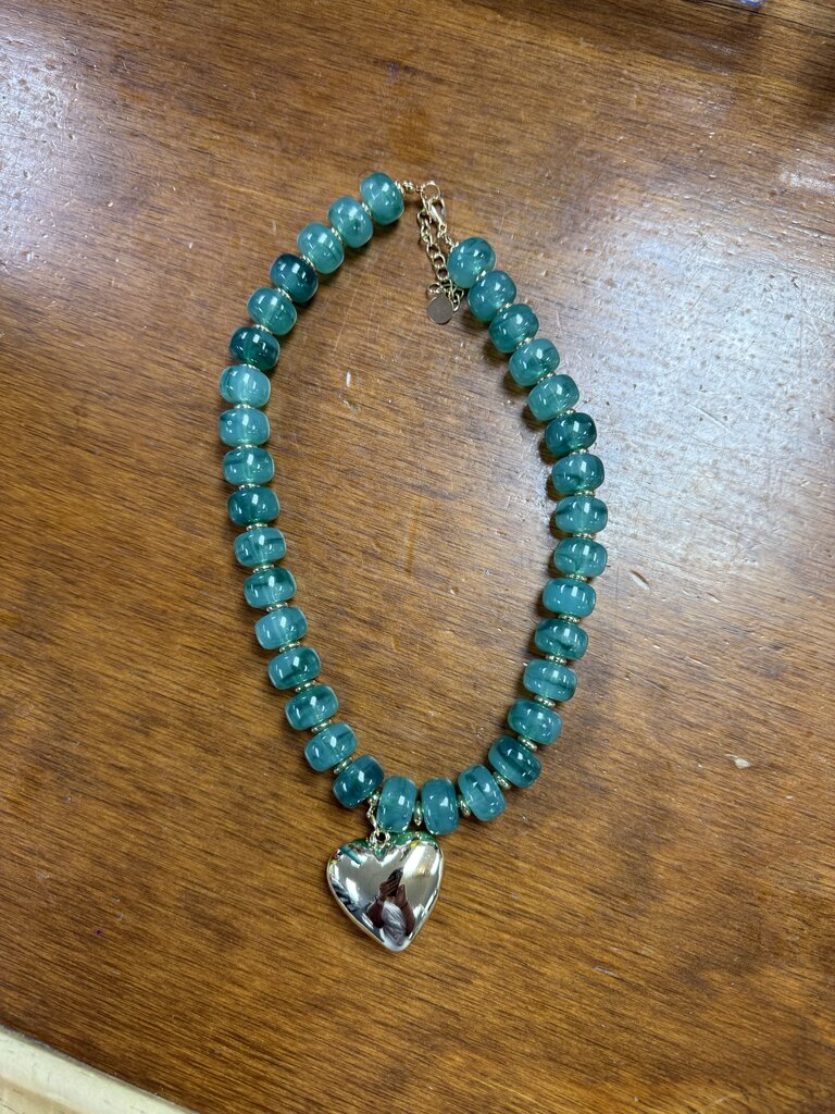 green beaded necklace with heart