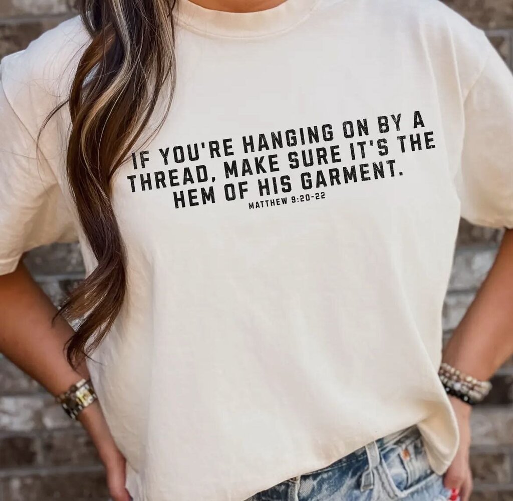 Hem of his garmet tee