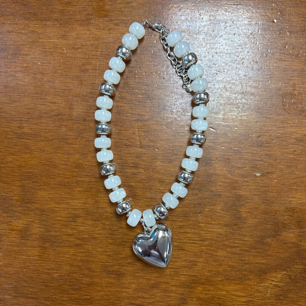white and silver beaded necklace with heart
