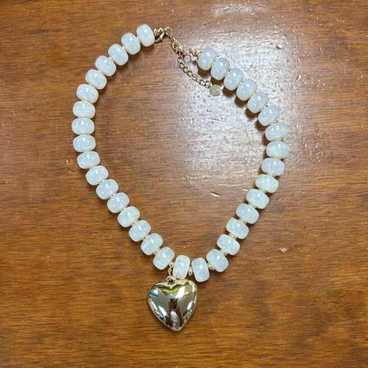 white beaded necklace with heart